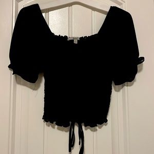 A black top from Papaya in a size small!🖤